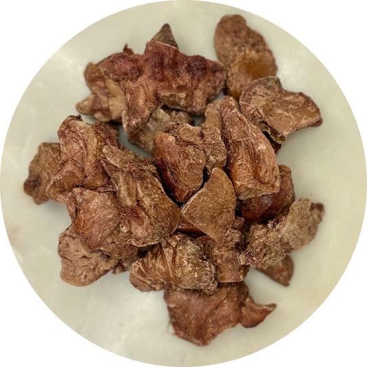 Freeze dried chicken liver treats for dogs and cats in a circular dish.