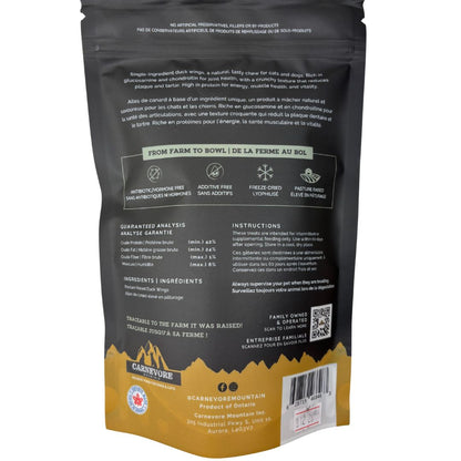 Freeze dried duck wings dog treats packaging with ingredient analysis and feeding instructions.