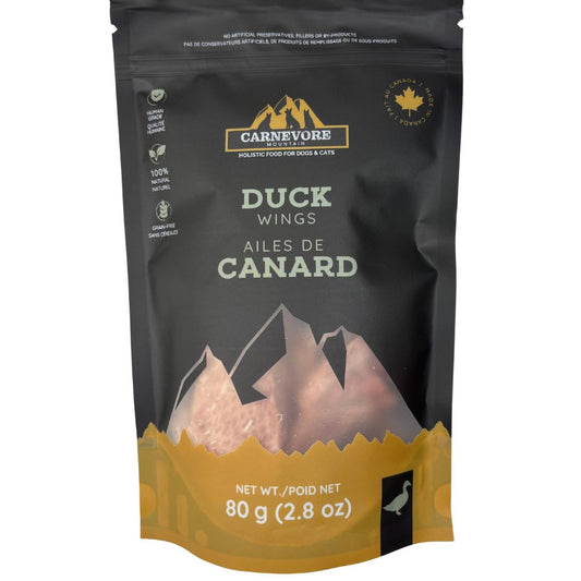 Freeze dried duck wings dog treats in a resealable bag, featuring a mountain design and nutritional information.
